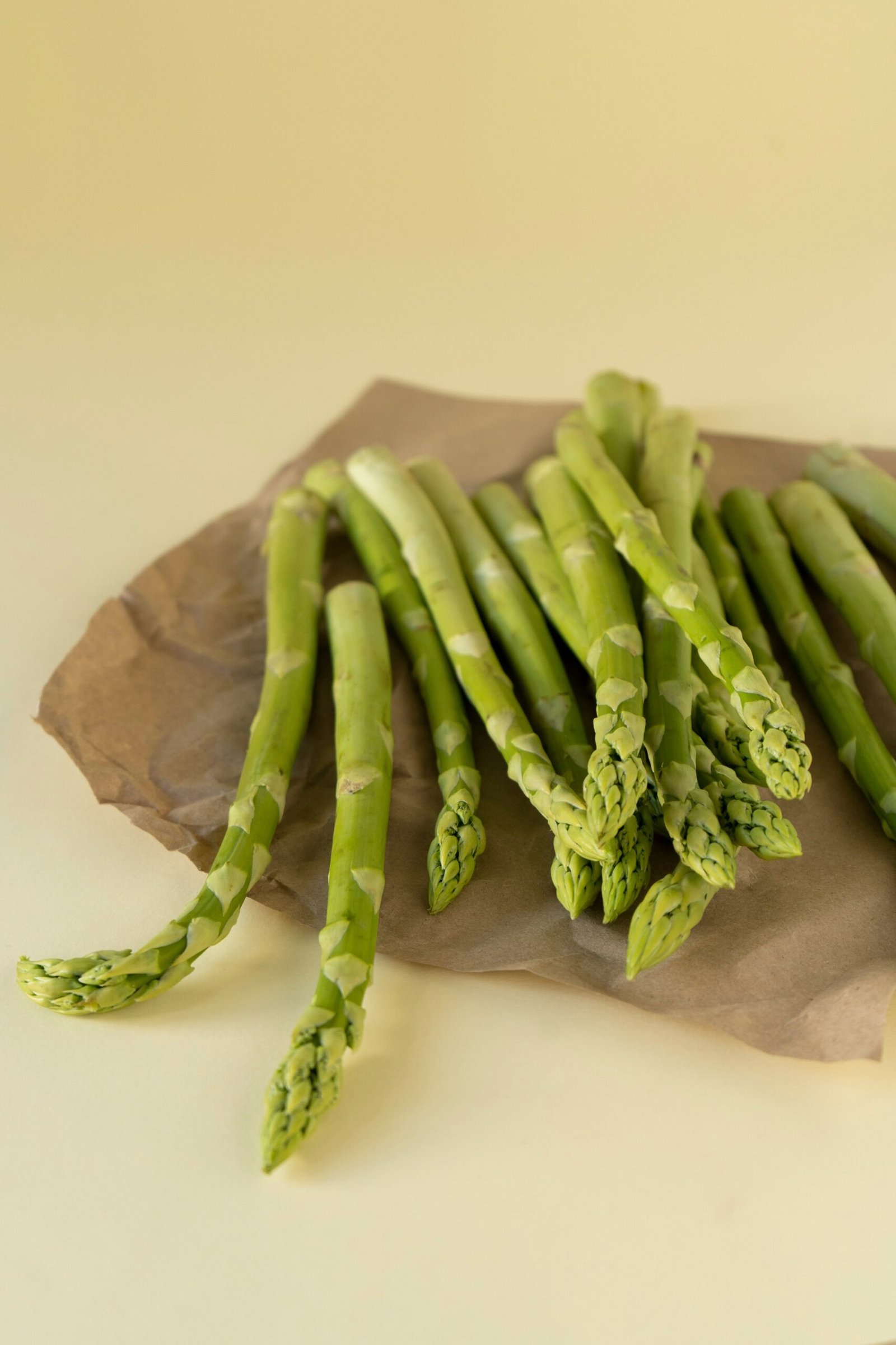 a bunch of asparagus sitting on a piece of paper