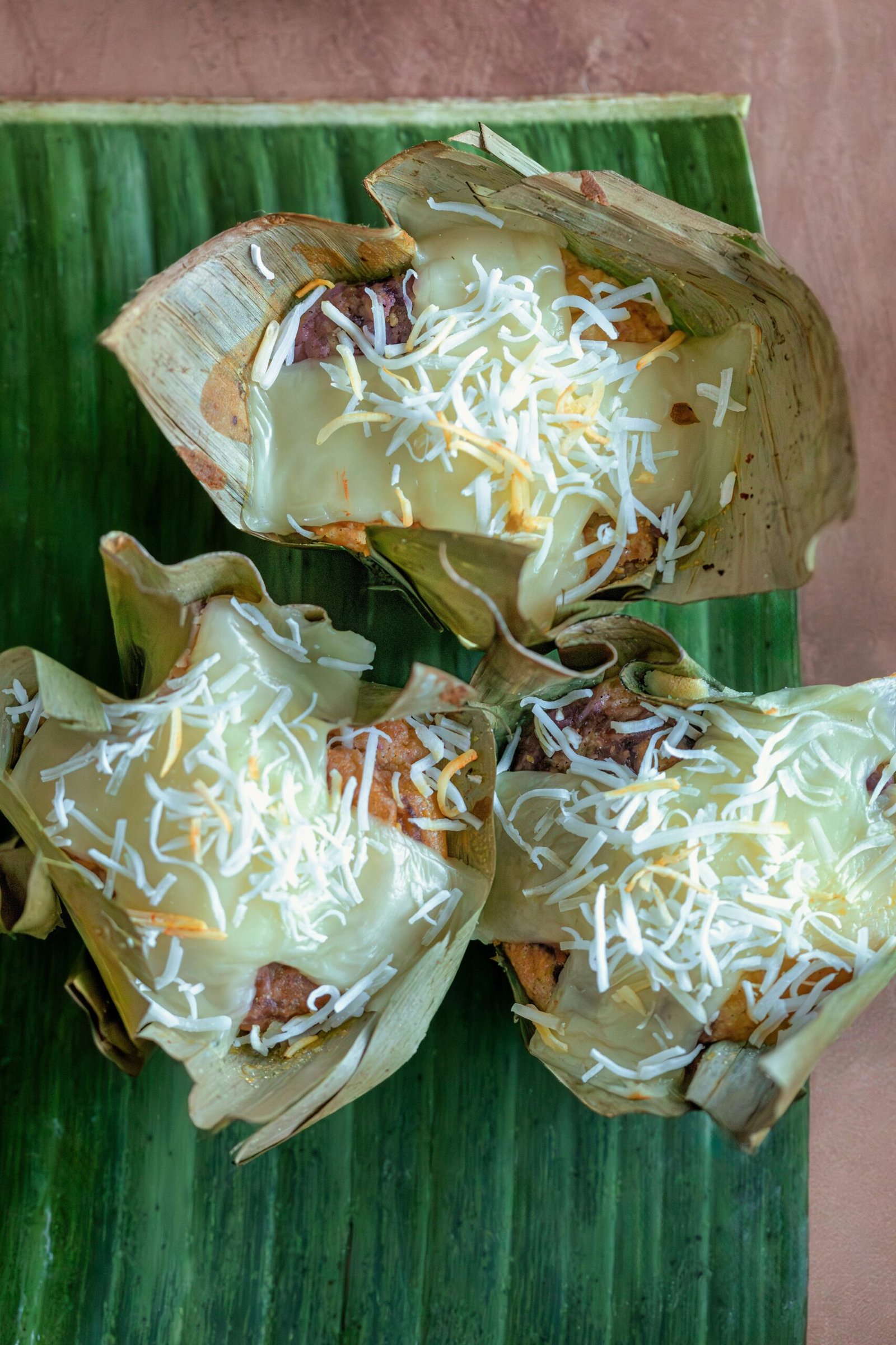 a plate of food on a banana leaf